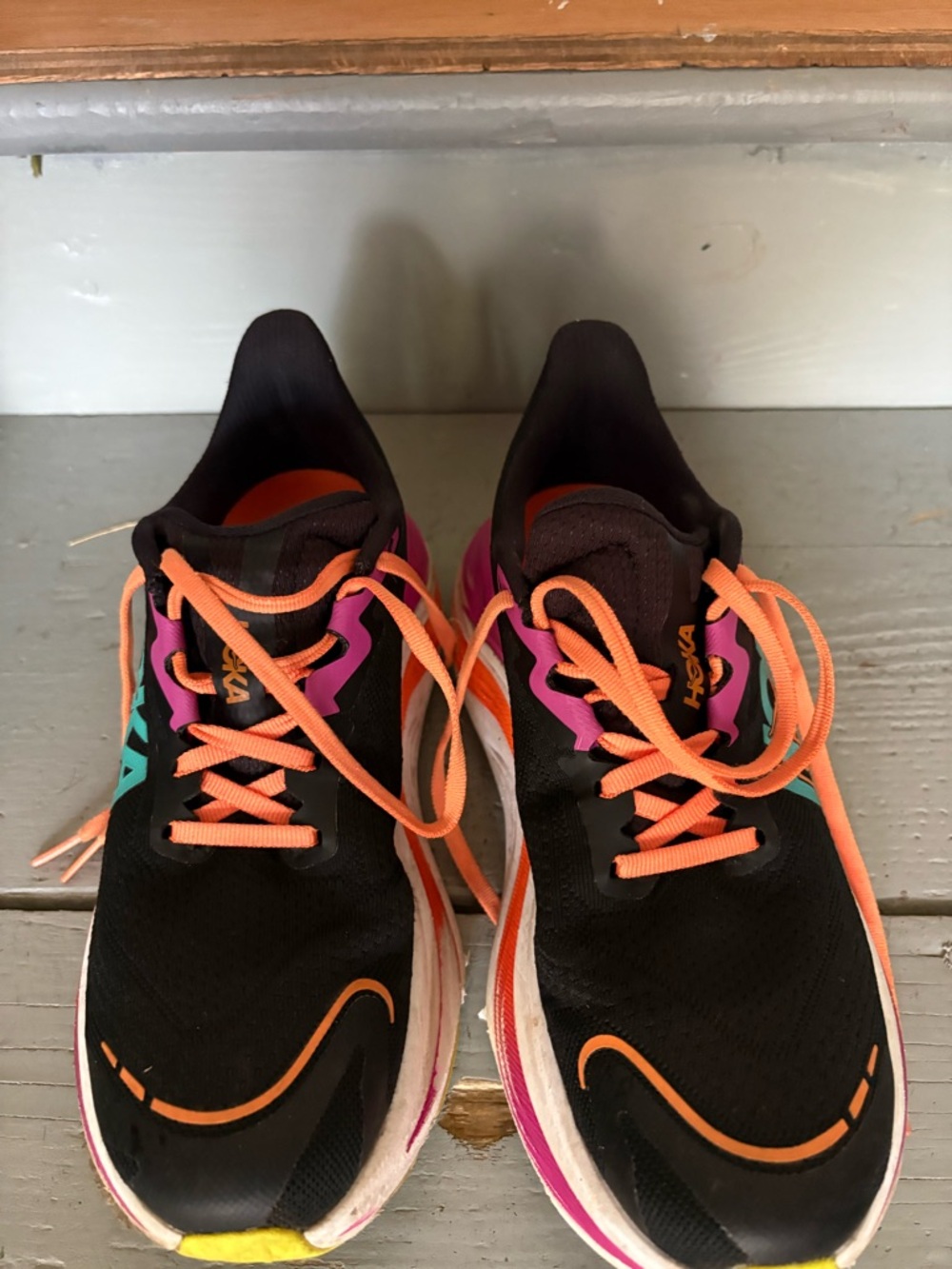 Hoka Women's Black Running Shoes with Orange Laces and Pink Accents